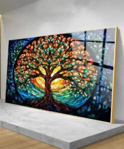 tableau arbre de vie coloré avec cercle autour de l'arbre posé dans une pièce contre un mur