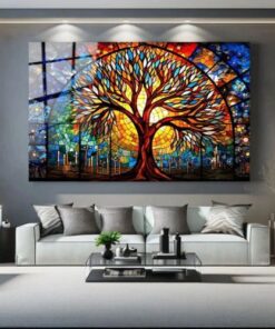 tableau arbre de vie coloré style contemporain et abstrait multicolore dans un salon avec canapé gris et table basse en verre